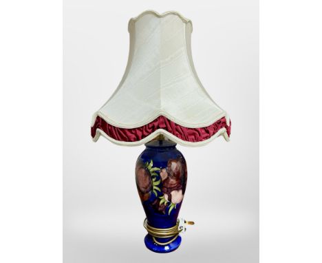 A Moorcroft table lamp with shade, overall height 65cm.