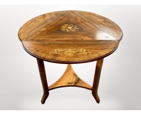 A Victorian rosewood and satin wood-strung drop leaf occasional table, diameter 70 cm extended, height 68 cm 
