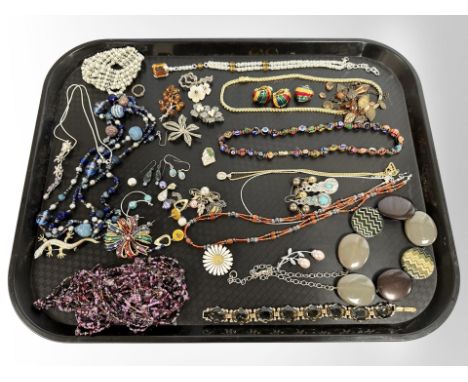 A quantity of costume necklaces and earrings, Danish silver and enamel floral brooch etc