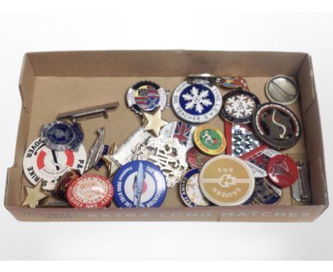 A collection of enameled pin badges including Corgi, Robertsons, Order of the Knights of the Road, etc.