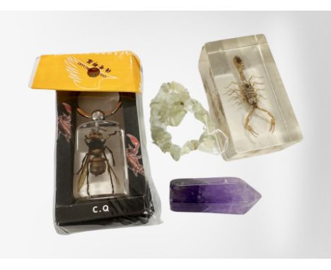 An amethyst tower and moonstone bracelet together with golden scorpion and Giant hornet in resin