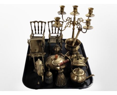 A group of brass wares including pair of miniature rocking chairs, table candelabrum, teapots, horse and carriage, pestle and