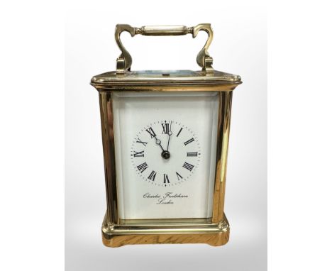 A brass-cased striking and repeating carriage clock by Charles Frodsham, London, height 17cm including handle. CONDITION REPO