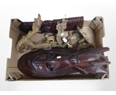 Two carved hardwood tribal masks, group of gilt light fittings 