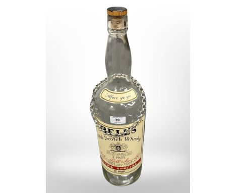 A large Bell's Old Scotch Whisky Bottle, height 52cm, together with a large belcher link necklace.