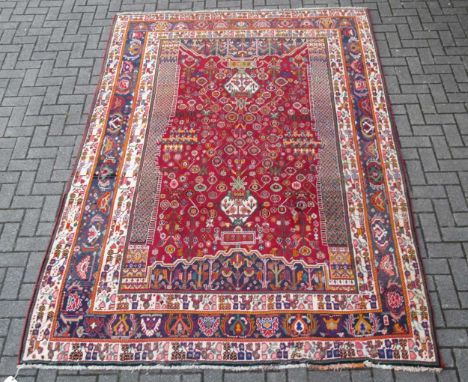 A Qashqai carpet with intricate design in vivid colours, 295 x 210cm