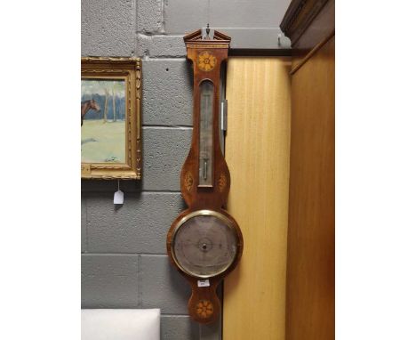 A mahogany and paterae inlaid wheel barometer signed Somalvico Lione and Co.,19th century, restored pediment, 98cm highPedime