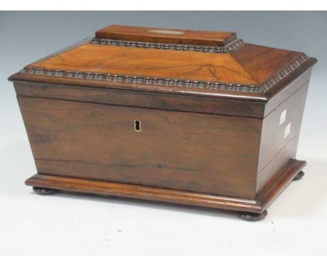 A Regency rosewood sarcophagus shaped tea caddy, 21.5 x 35 x 23cmThis item is offered for sale in accordance with the Ivory A