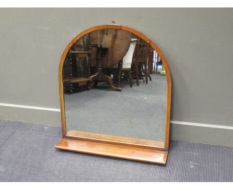 A large hall mantle mirror of arched form with single shelf, 84 x 74.5cm; together with another smaller gilt wall mirror, 47 