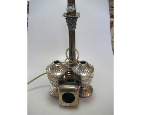A pair of Victorian silver oil lamp bases, a silver candlestick converted to an electric lamp and a silver fronted pocket wat