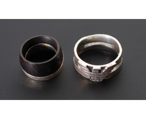 EMPORIO ARMANI, TWO SILVER RINGS; silver and black wood ring, K 1/2, and an emblem ring, T 1/2, marks for Emporio Armani, 20.