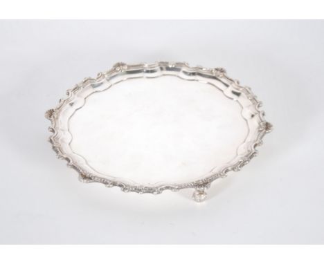 SILVER SALVER, with Chippendale and shell-capped border on three scroll feet, by C.J. Vander Ltd, London 1965, 8 ¾" (22.2cm),