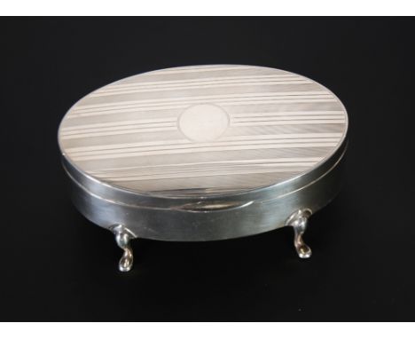 ENGINE TURNED SILVER OVAL TRINKET BOX, hinged lid, plush lined interior and raised on four scroll supports, Birmingham 1919, 