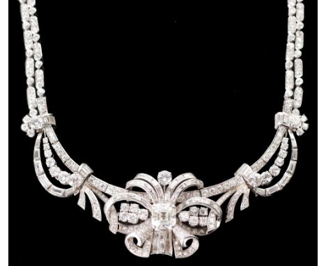 IMPRESSIVE DIAMOND SET NECKLACE, CENTRE SET WITH 4.16CT APPROX. EMERALD CUT DIAMOND, with brilliant and baguette cut scroll s