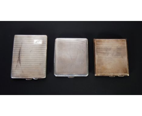 THEE ENGINE TURNED SILVER CIGARETTE CASES, Birmingham 1938, 4.2oz, Birmingham 1943, 4.6oz and Birmingham 1936, 4.15oz (3) 