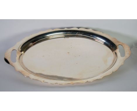 PLAIN SILVER OVAL TWO HANDLED TEA TRAY, the curved border having cyma edge and cut out handles, 21 5/8" wide, makers Walker a