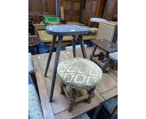 An antique painted oak Milking Stool, together with a mahogany framed overstuffed stool (2)