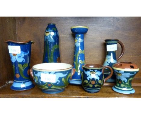 Crown Dorset Pottery; seven pieces of blue ground Art Nouveau design, including candlestick, vases, jug etc (7)