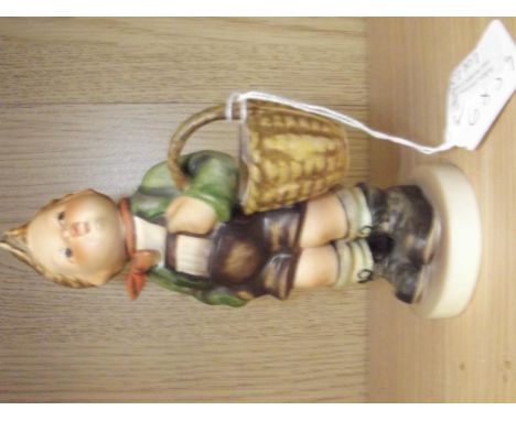 Goebel figure of a boy holding basket