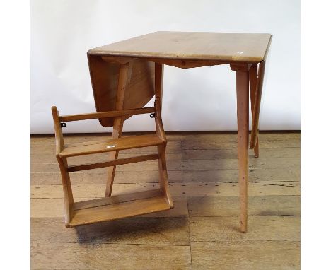 An Ercol light elm drop leaf dining table, 75 cm wide, three chairs, and a wall shelf, 43 cm wide (5)Table: top scratched and