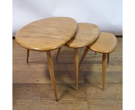 A nest of three Ercol Pebble tables, the largest 64 cm wide, the smallest 33 cm wideVarious water stains and ring marks to th