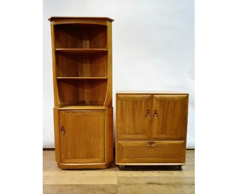 An Ercol light elm corner cabinet, 180 cm high x 77 cm wide, and a matching TV cabinet, 95 cm high x 51 cm deep x 86 cm wide 