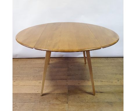 An Ercol light elm drop leaf dining table, 113 cm wideOverall condition good, light wear, no splits to topIt has a blue label