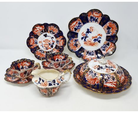 A Foley part tea service, in an Imari palette, decorated flowers (qty)Some lossesCups: 2 of cups in pieces. Some staining to 