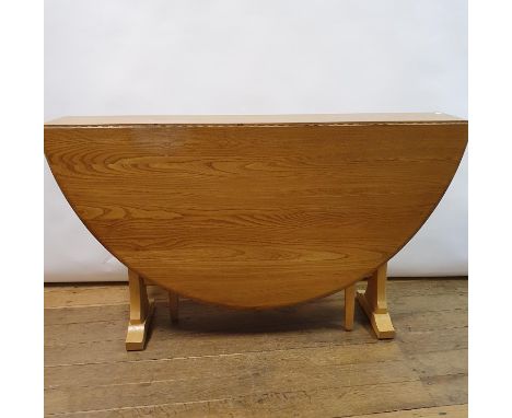 An Ercol elm drop leaf dining table, 140 cm wide 