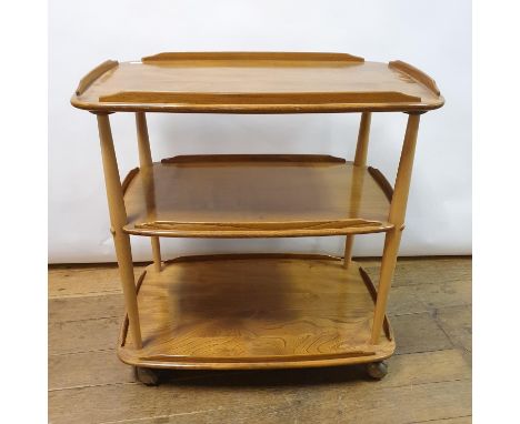 An Ercol elm three tier trolley, 71 cm wideStructurally sound. Light wear, various scuffs to ball casters 