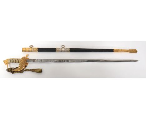 Elizabeth II Royal Navy Officer's Sword By Wilkinson 30 3/4 inch, single edged blade with fuller. &nbsp;Etched oak leaf and r
