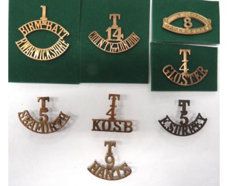 8 x Territorial Shoulder Titles brass titles include 1st Birmm. Batt R. Warwickshire ... 8 City Manchester ... T.4 Gloster ..