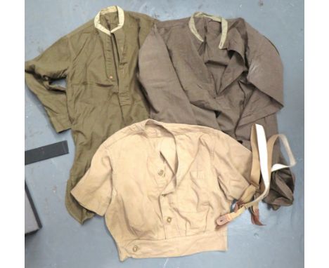 Three Military Shirts consisting 2 x WW2 khaki, collarless, half fastened front, cotton examples. &nbsp;Some minor moth nips 
