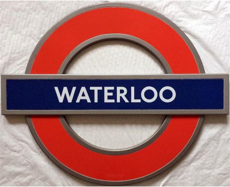 London Underground enamel roundel STATION SIGN 'WATERLOO'. A modern "silhouette" roundel in an integral alloy frame and made 