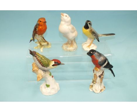 A 20th century porcelain model of a bullfinch perched on a tree stump, in the Meissen style, 16cm high, a Goebel 'Robin', 12c