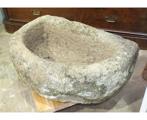 A granite half-round trough, 80cm x 50cm, 26cm deep.