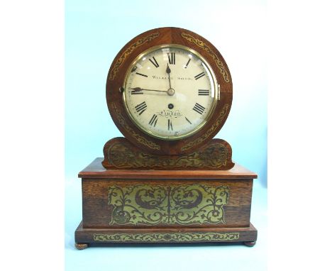 William Dodd, London, a Regency rosewood mantle clock, the brass inlaid case of circular form supported by an oblong plinth, 