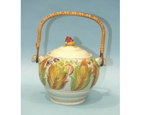 A Clarice Cliff Newport Pottery biscuit barrel, shape No.38A, with raised decoration of autumn leaves and berries and wicker 