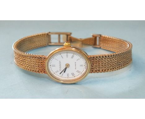 Tissot, a lady's quartz movement wrist watch with 9ct gold oval case and integral bracelet, 19.1g.