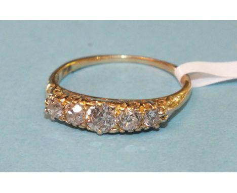 A Victorian five-stone diamond ring, the five graduated old brilliant-cut diamonds in 18ct gold galleried mount, size M, 2.4g