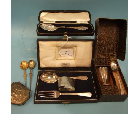 A cased Harrods christening set comprising spoon, fork and napkin ring, makers Wakeley &amp; Wheeler, London 1948, a spoon in