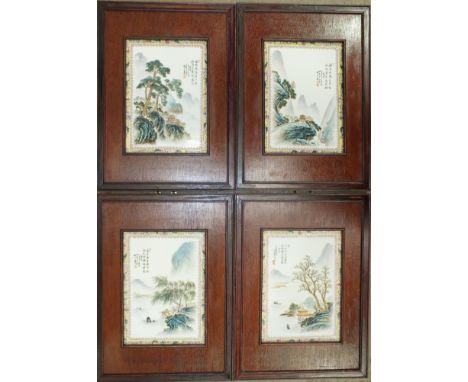 A set of four modern Canton-style ceramic plaques painted with scenery in famille colours and signed, within wooden frames, e