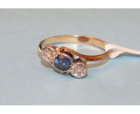 A sapphire and diamond cross-over ring set a round-cut sapphire and two 8/8-cut diamonds, in unmarked mount, size L, 2.3g.