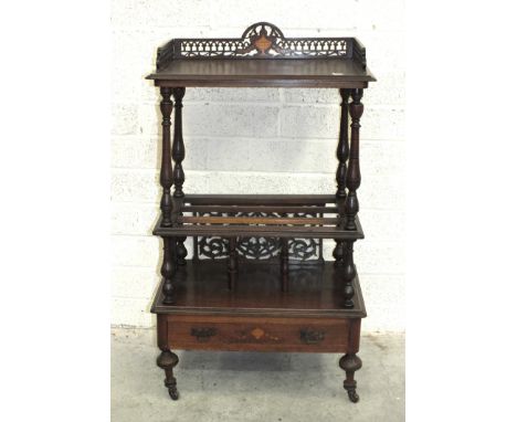 A mahogany music Canterbury, with galleried shelf above base drawer, on turned legs, 60cm wide, 104cm high.