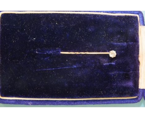 A diamond stick pin, claw set a brilliant cut diamond (0.2cts approx.).