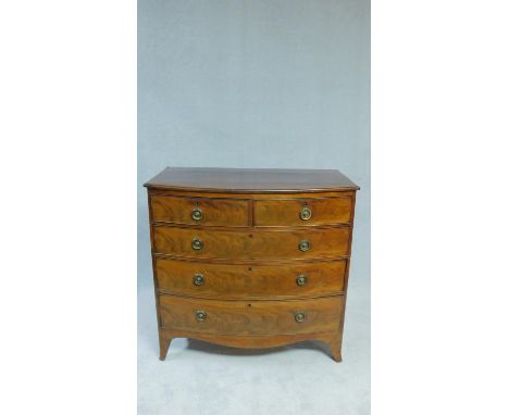 A Regency mahogany bowfronted chest of two short above three long drawers on swept bracket supports. H.103 W.106 D.56cm 