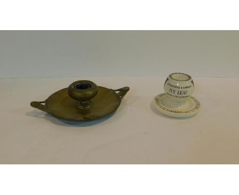 An Art Nouveau style brass inkwell along with an antique Royal Doulton advertising match striker, 'Tanqueray, Gordon &amp; Co