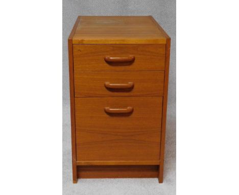 A 1970's vintage light oak pedestal cabinet fitted with three drawers. H.64 W.39 D.64cm 
