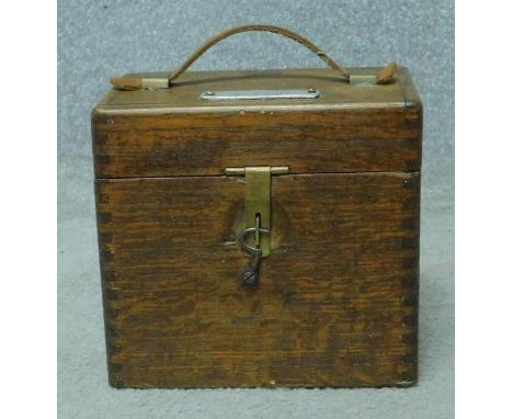 A vintage oak cased West-Skinn of Glastonbury racing pigeon automatic timing clock. With key. H.18 W.19 D.12cm 