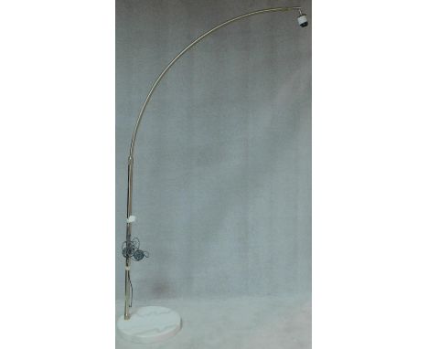 A chromium floor standing arc lamp on marble base, lacks shade. H.218 W.45 D.45cm 